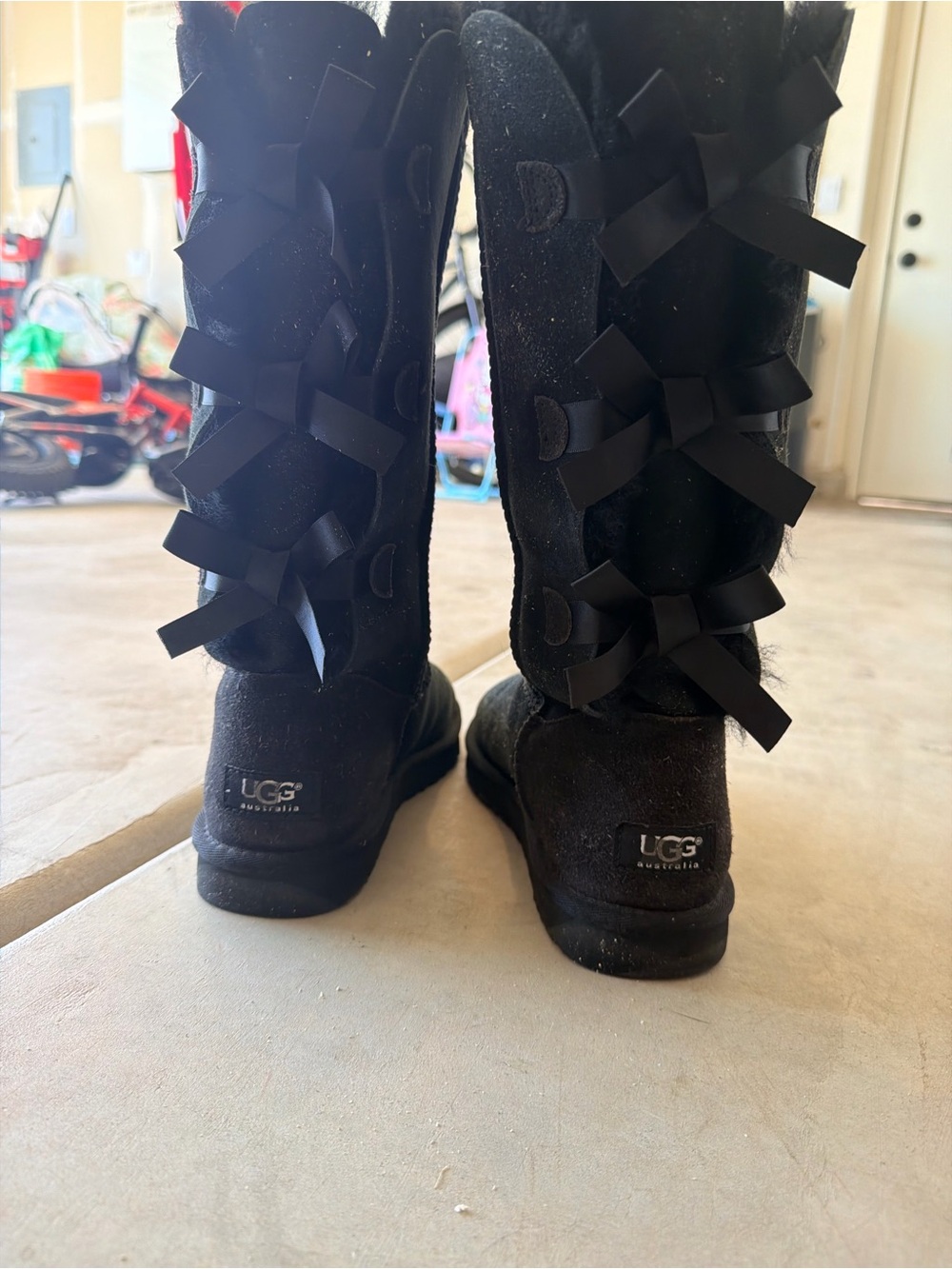 Black Ugg bow boots